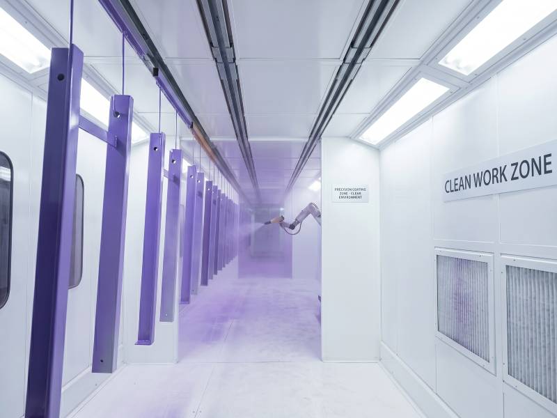 Automated clean zone powder coating for car parts