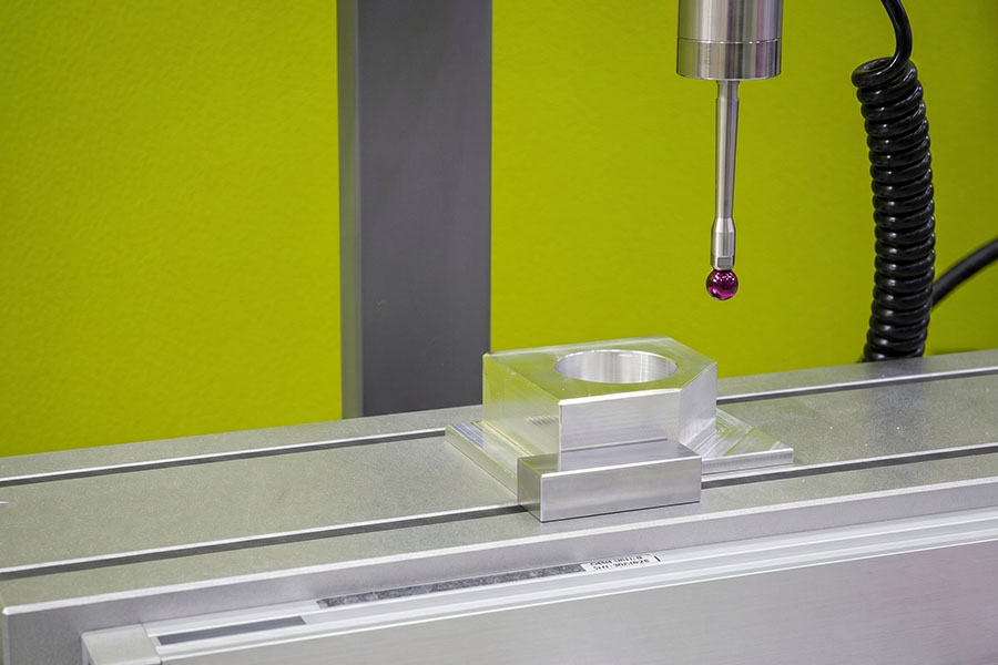 CMM machine measuring a metal component