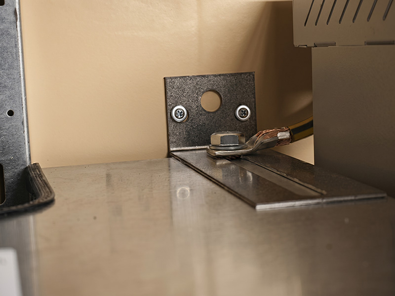 Value-added electromechanical assembly with ground stud installation