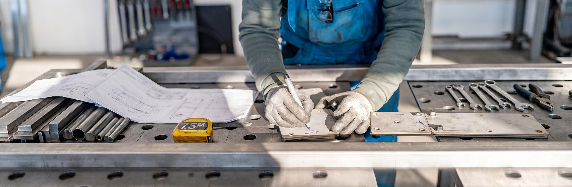 Engineer marking and measuring for precise wall mount installation