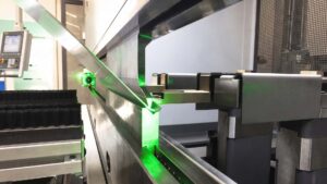 CNC press brake operator controls the metal bending process