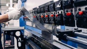 Close-up of press brake punch and v-die