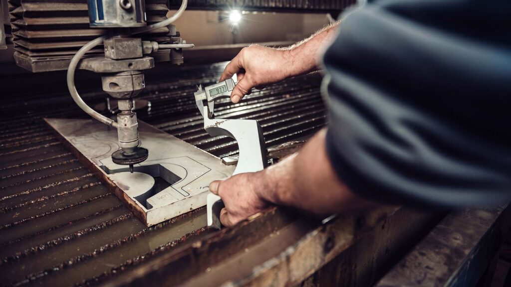 Measuring metal part with a digital caliper