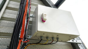 New wall-mounted industrial electrical box with cables