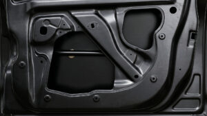 Stamped sheet metal part with stiffening ribs and cutouts