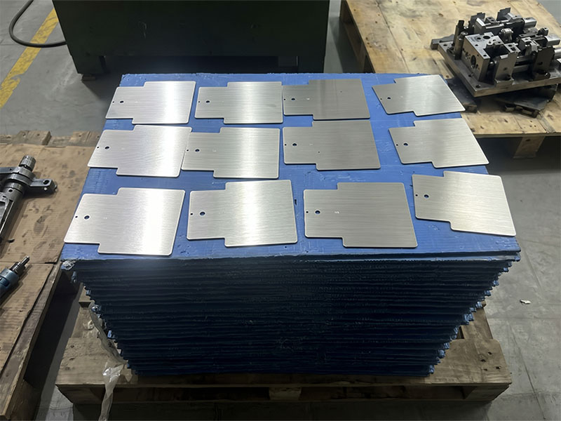 Thin-gauge sheet metal parts protected by custom blue dunnage