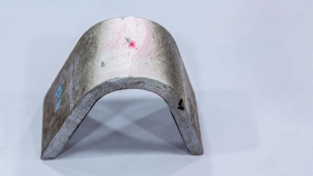 Aluminum alloy bend test specimen with crack detection