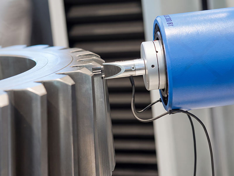 CMM probe measuring precision machined metal gear