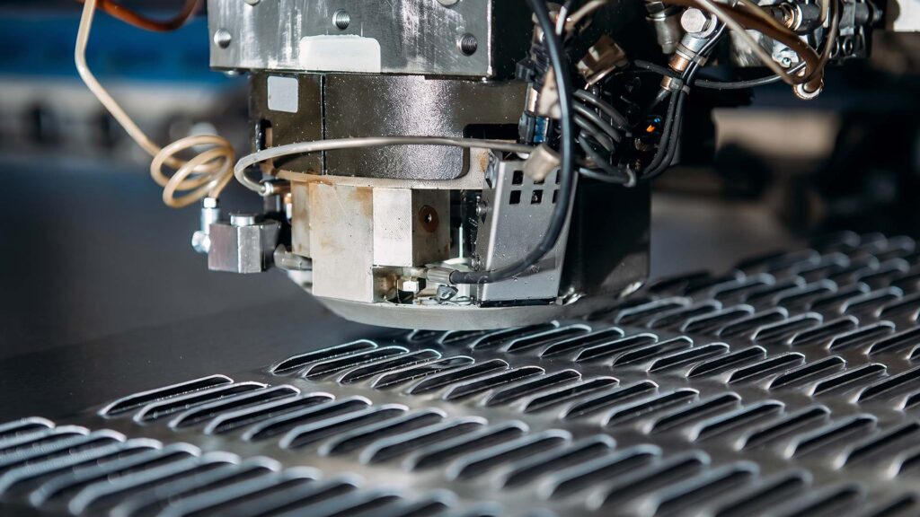 Close-up of CNC turret punch press head with tools