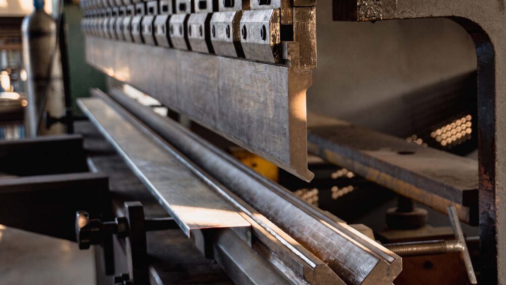 Close-up of press brake bending sheet metal