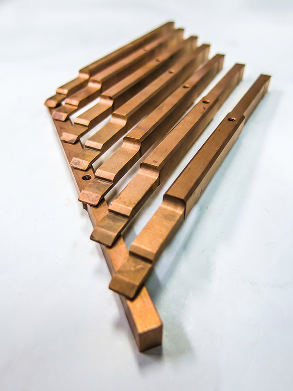 Metal racks for electrical contact in anodizing baths