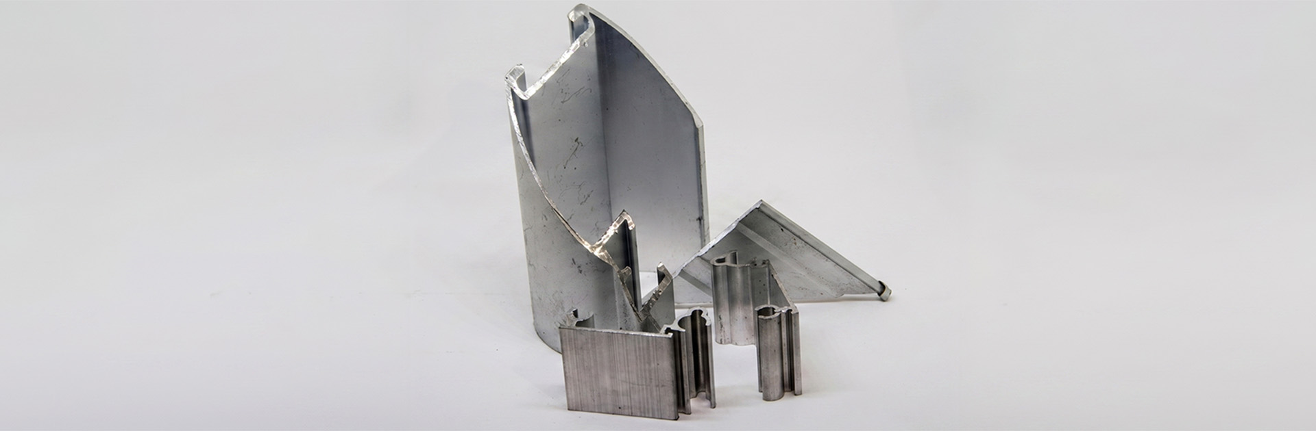 Raw aluminum parts showing mechanical tool marks