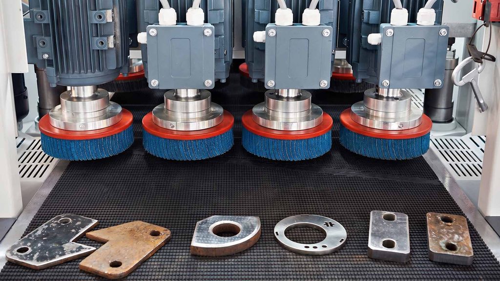 Automated sheet metal deburring machine with rotary brushes