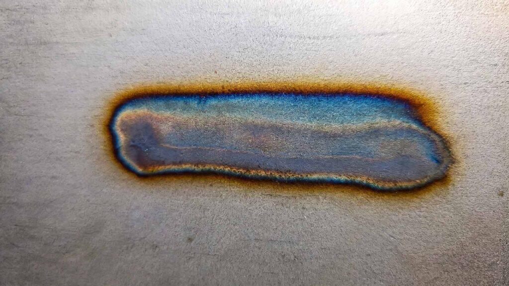 Blue and purple heat tint on stainless weld