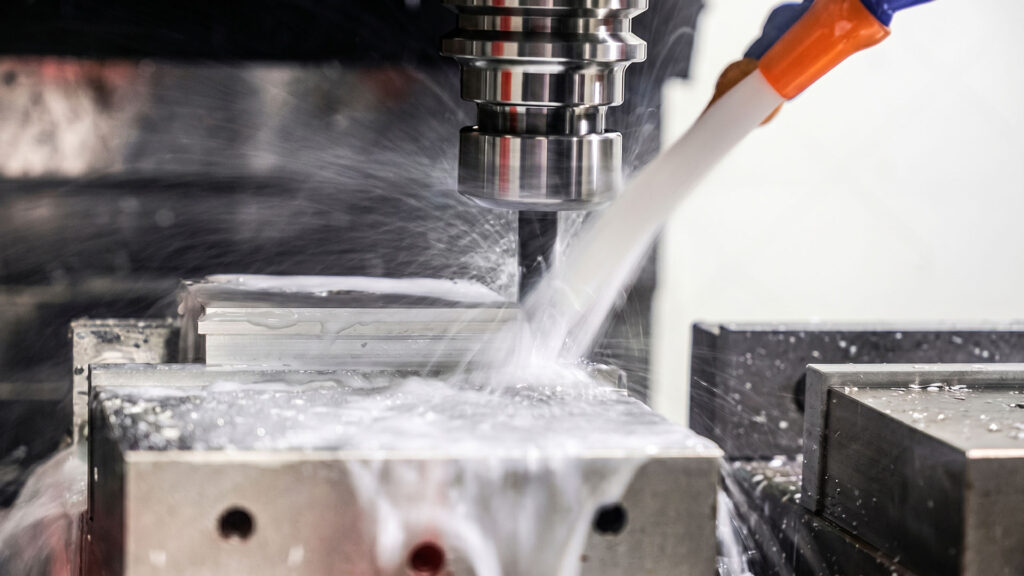 CNC milling machine flooding aluminum cut with coolant