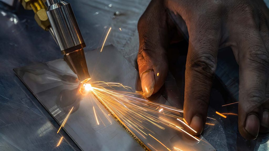 Close-up of MIG welding process with sparks