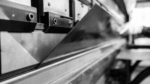 Close-up of a press brake bending sheet metal