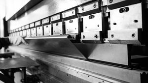 Close-up of press brake bending sheet metal