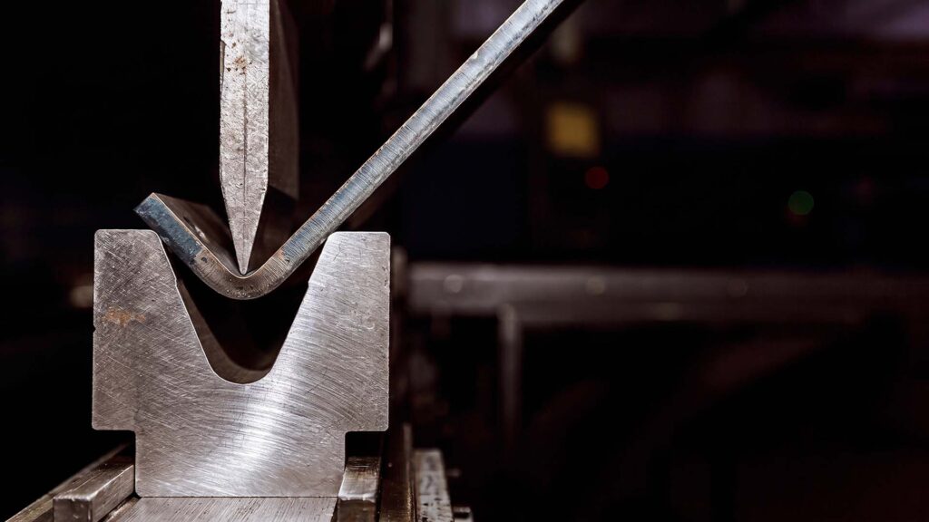 Fabricated custom sheet metal bracket held by operator