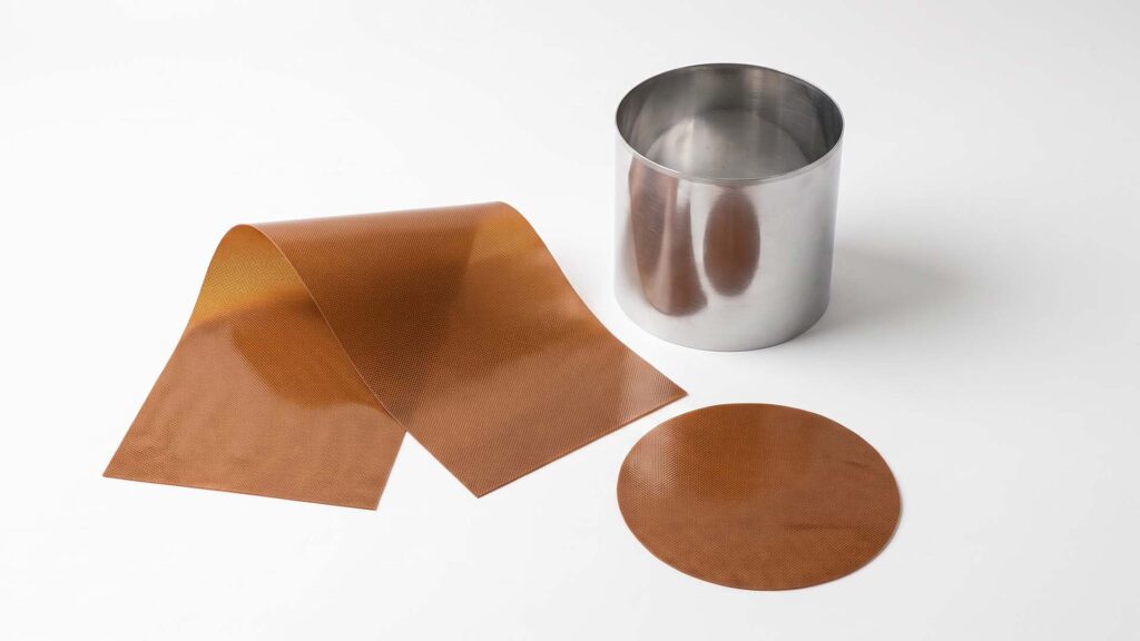 Flat metal blank and seamless drawn cylinder