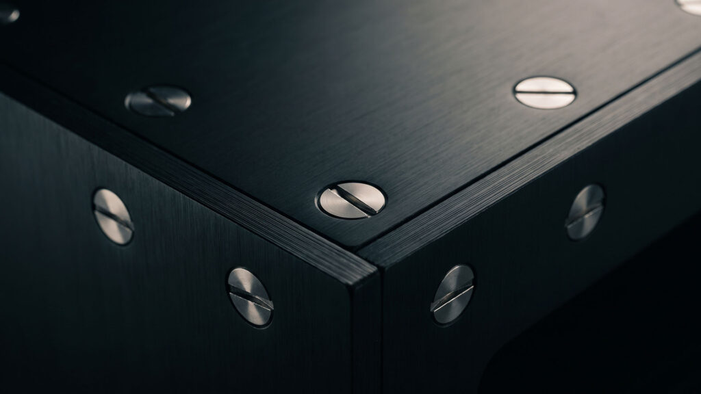 Flush screws on black sheet metal server rack