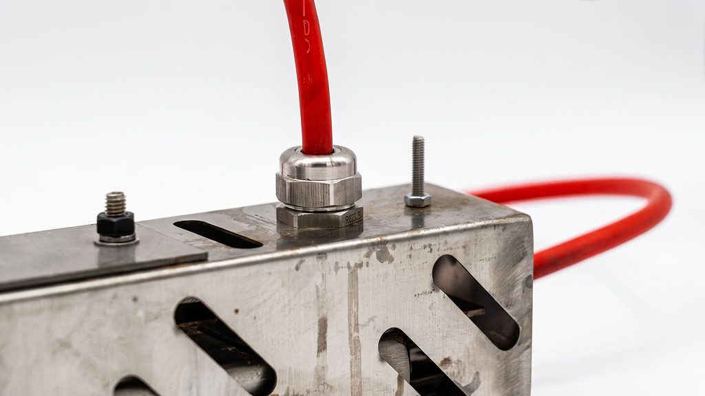Metal cable gland installed on electrical enclosure