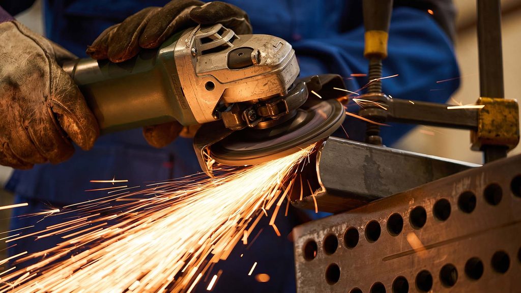 Metal fabrication finishing with angle grinder