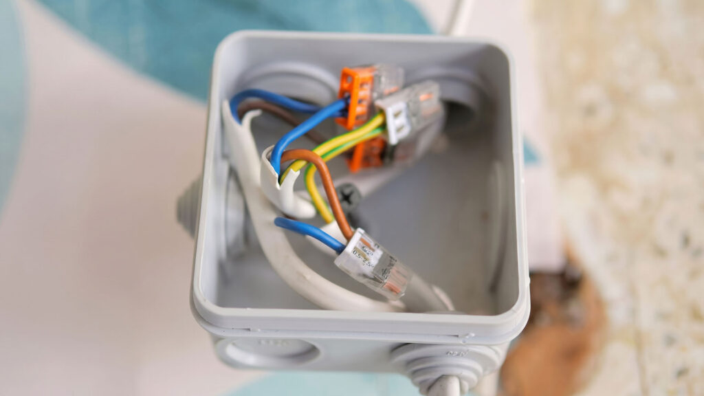 Waterproof cable gland sealing an industrial enclosure