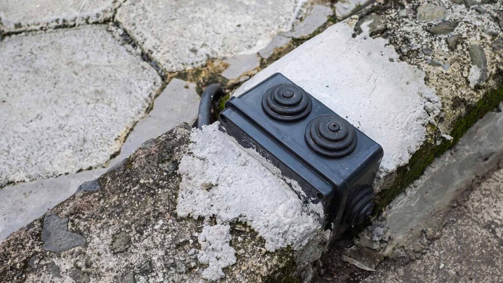 Waterproof outdoor junction box on wet ground