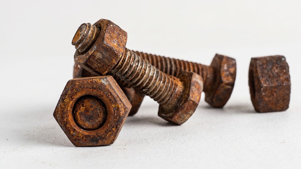 Severely corroded industrial bolts and nuts